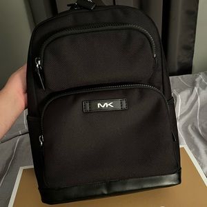 Mens Michael Kors backpack. NWT and still in the gift wrapped box